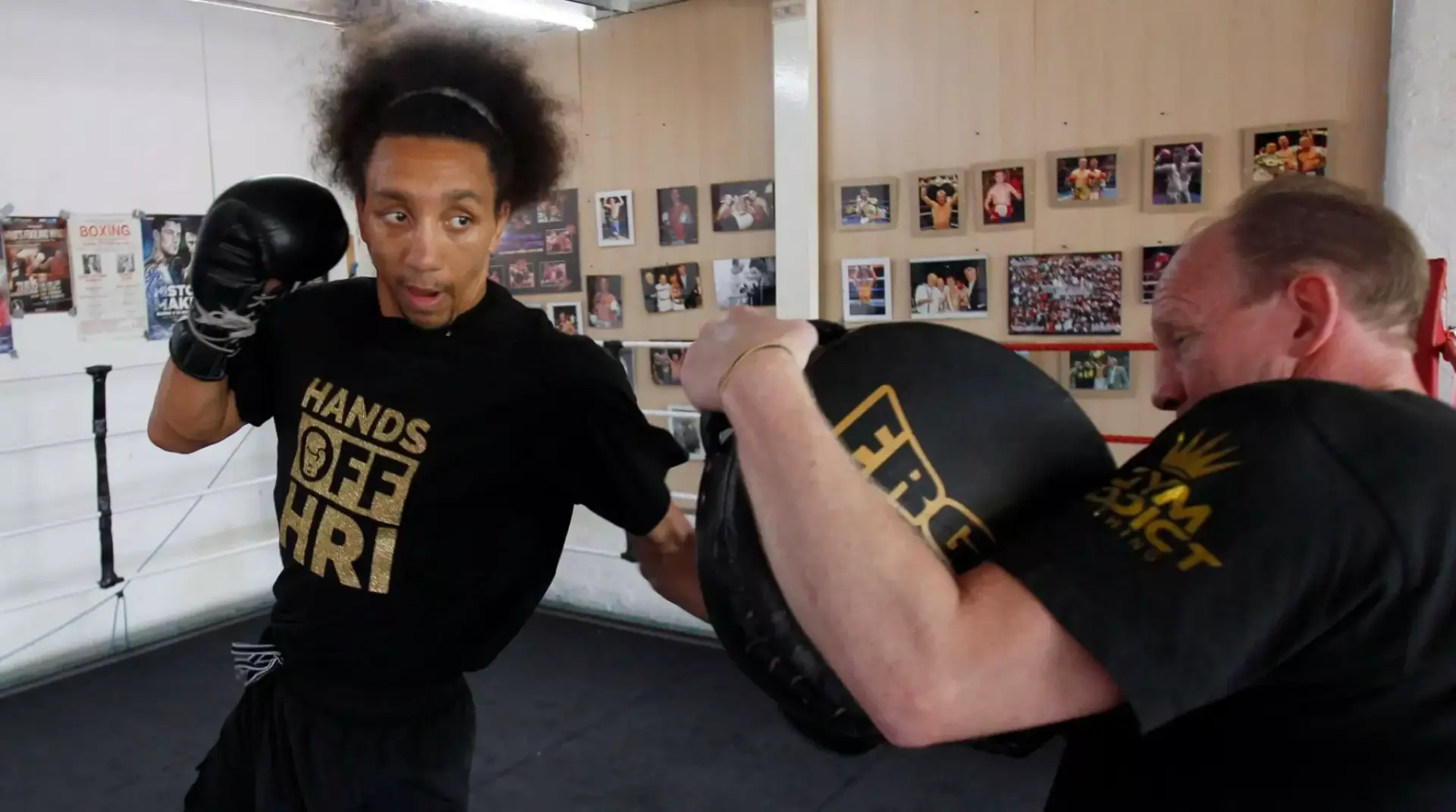 Tyrone Nurse hitting pads with Chris Aston inside Aston boxing club